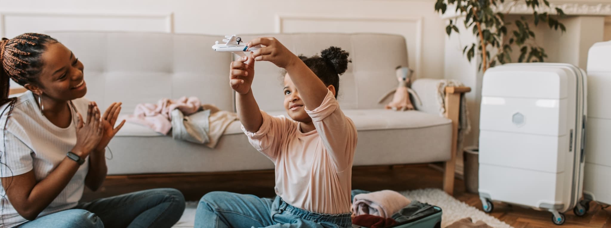 Child playing joyfully with a toy airplane — the confidence and freedom that comes after an ADHD assessment at MMHC